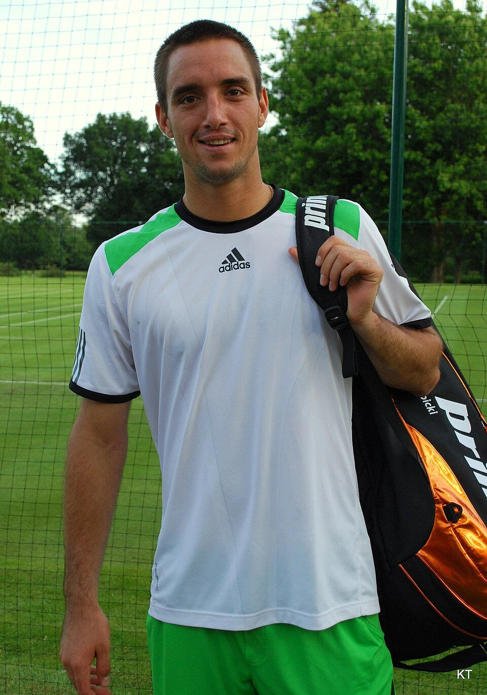 Viktor Troicki on a tennis court in action