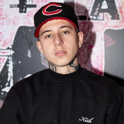 Portrait photo of Victor Fontanez (VicBlends) wearing a black cap and sweatshirt against a graffiti-style background.