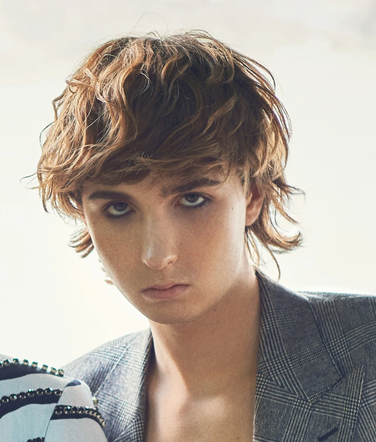 Portrait photo of Thomas Raggi, guitarist of Måneskin, in a close-up editorial-style image.