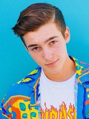 Portrait photo of Roy Purdy against a blue background