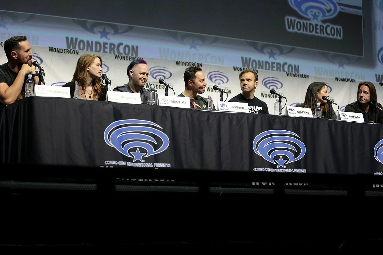 Sam Riegel on a panel at WonderCon, seated at a table with other Critical Role cast members.