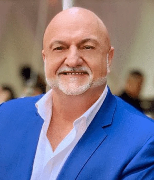 Portrait photo of Vlado Bosanac in a blue blazer and white shirt.