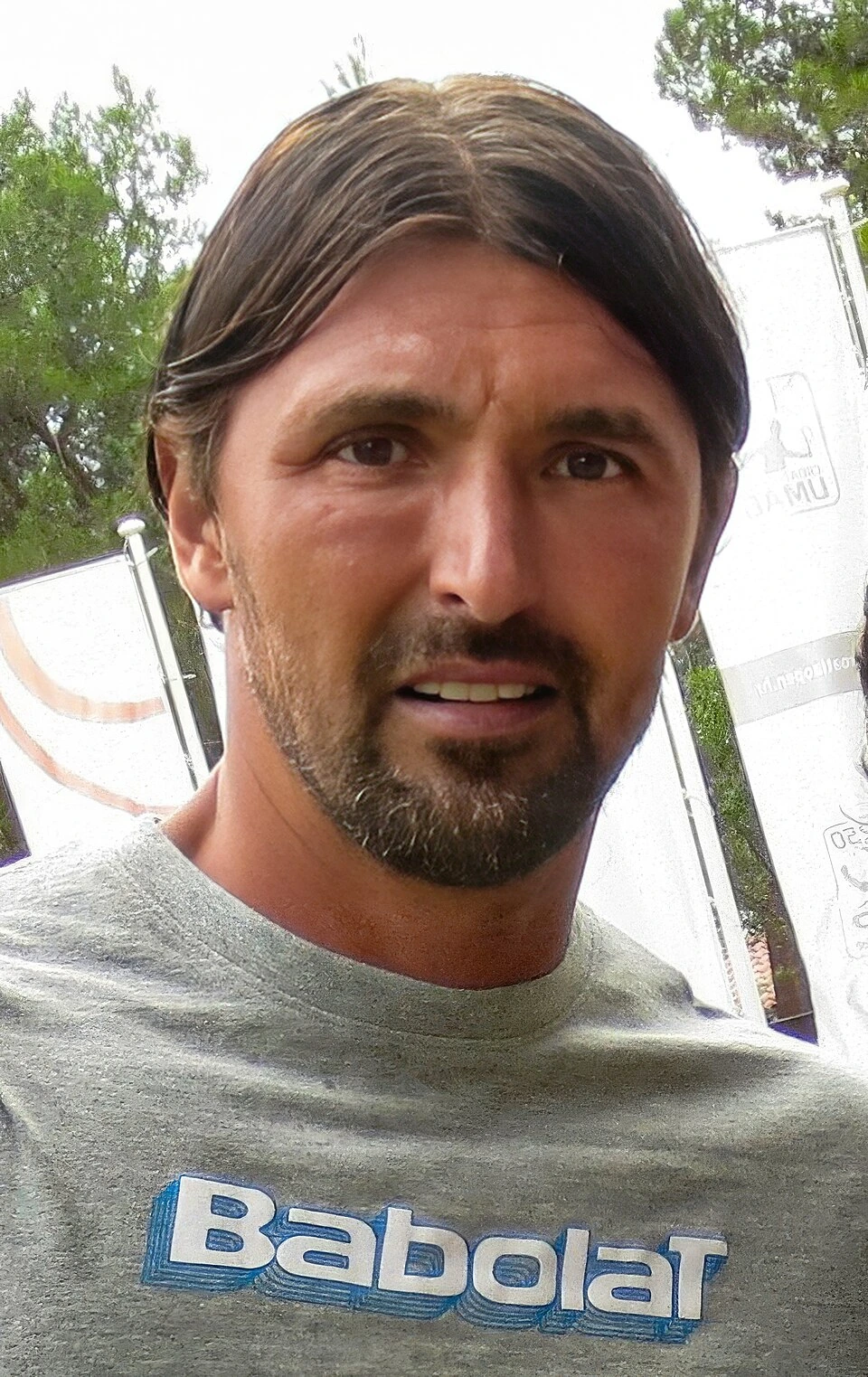 Goran Ivanišević in a close-up outdoor photo wearing a grey T-shirt