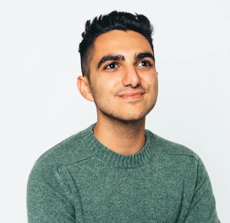 Portrait of Milan Kordestani against a plain light background