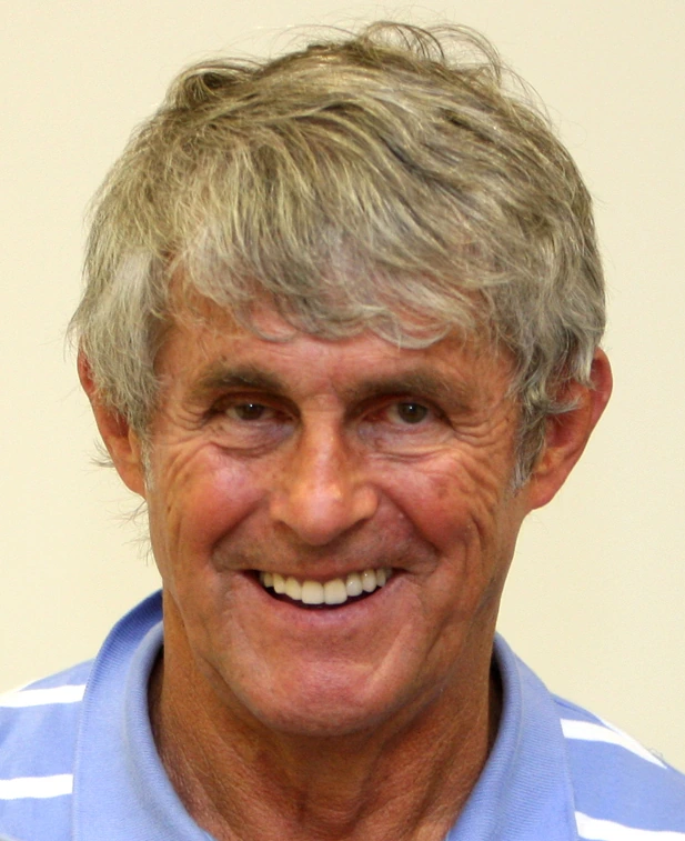 Portrait photo of Bora Milutinović smiling in a light blue shirt