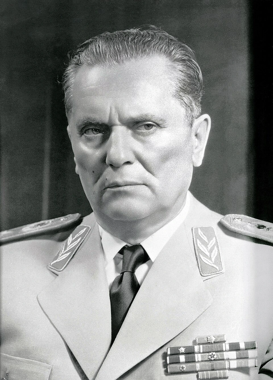 Black-and-white portrait of Josip Broz Tito in military uniform