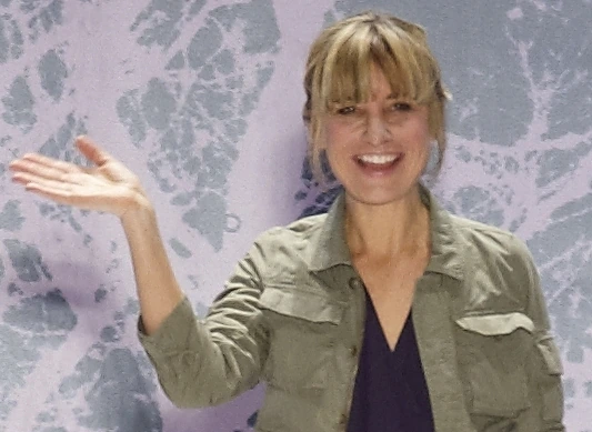 Amy Smilovic at a Tibi event, smiling and waving