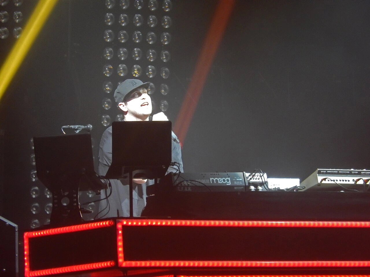 Pretty Lights performing live on stage at the Aragon in Chicago, with the artist behind a DJ setup and concert lighting.