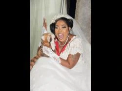 Queen Ladi Gangsta smiling in a white dress at a wedding-themed event