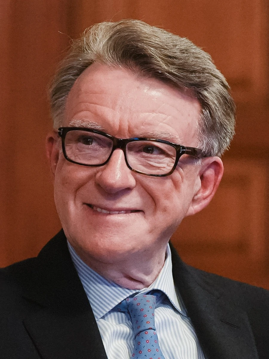 Peter Mandelson in a 2025 portrait photo wearing glasses and a suit