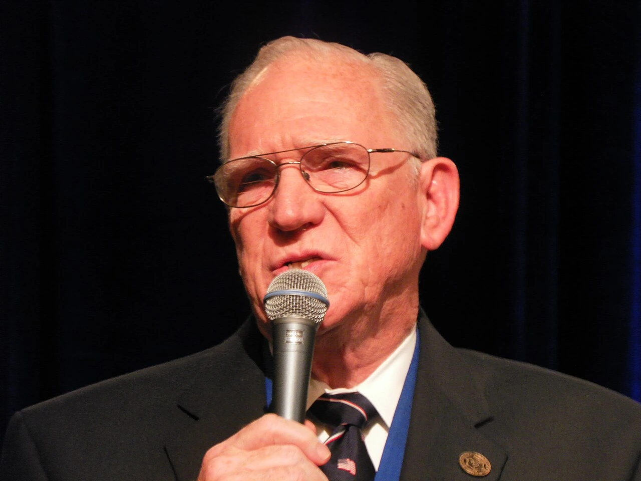 Charles W. "Chuck" Missler speaking at a conference into a microphone