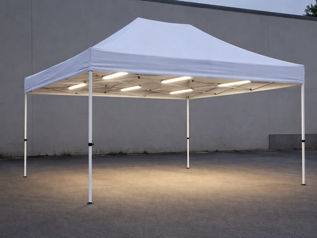 4x4 canopy tent with evenly spaced under-canopy bar lights illuminating the area below.