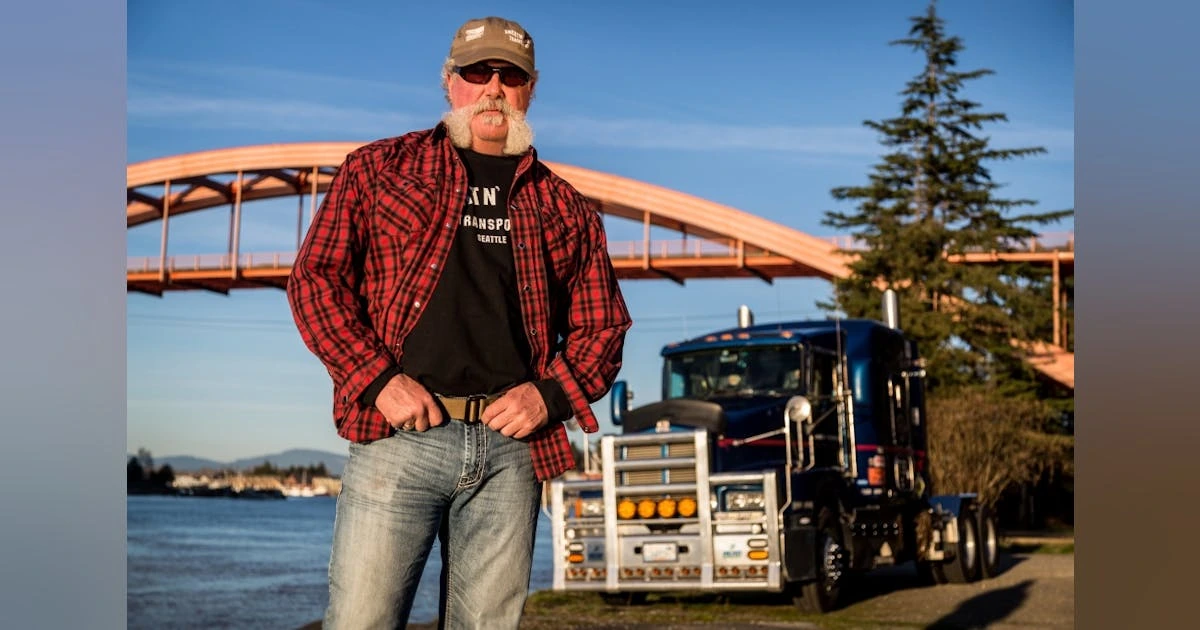 Marc Springer standing outdoors in front of his truck