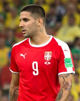 Aleksandar Mitrović in a Serbia national team jersey during a football match