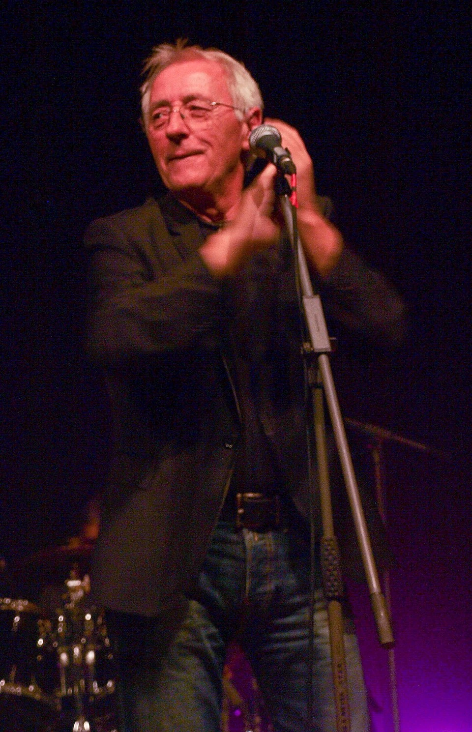 Oliver Dragojević performing on stage at a microphone