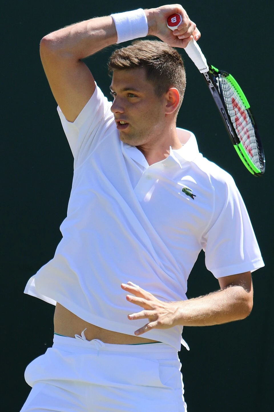 Filip Krajinović playing tennis in a match