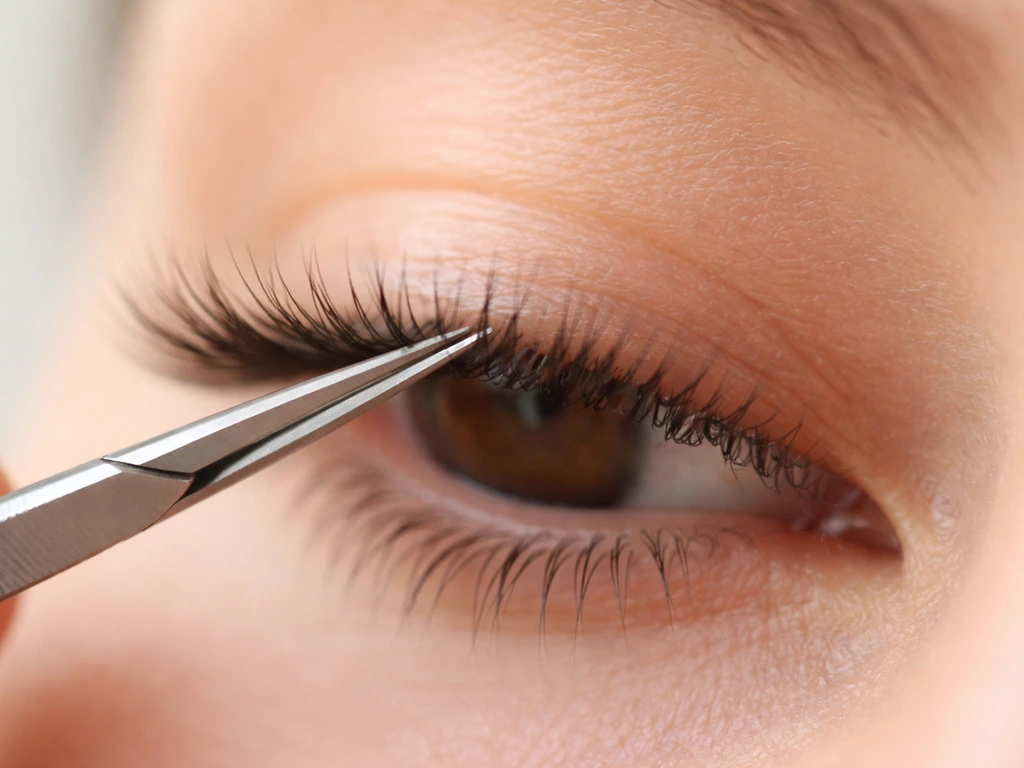 Close-up of carefully groomed eyelashes with tidy lash tips in soft natural light.