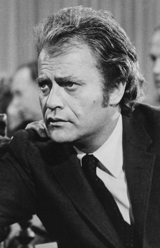Black-and-white portrait of actor Vic Morrow in a suit