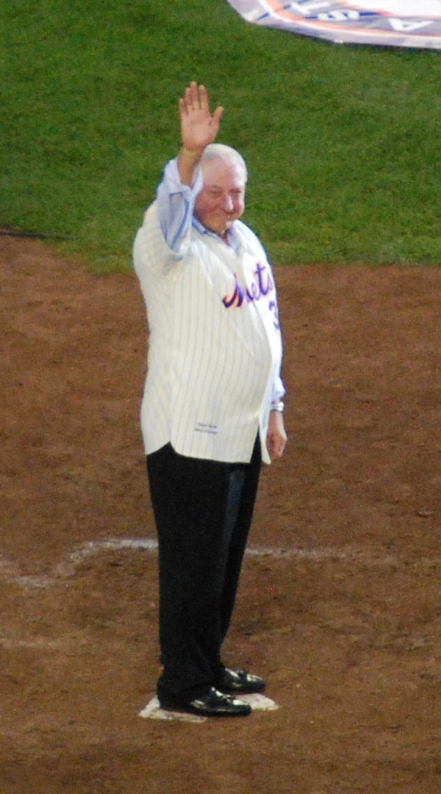 Jerry Koosman waving on the field in a New York Mets jersey