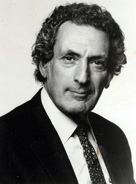 Portrait of Irv Koons in a suit and tie