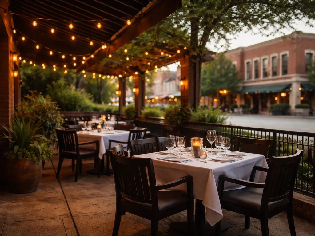 Empty outdoor patio dining area at a steakhouse on the Historic Downtown McKinney square at golden hour.