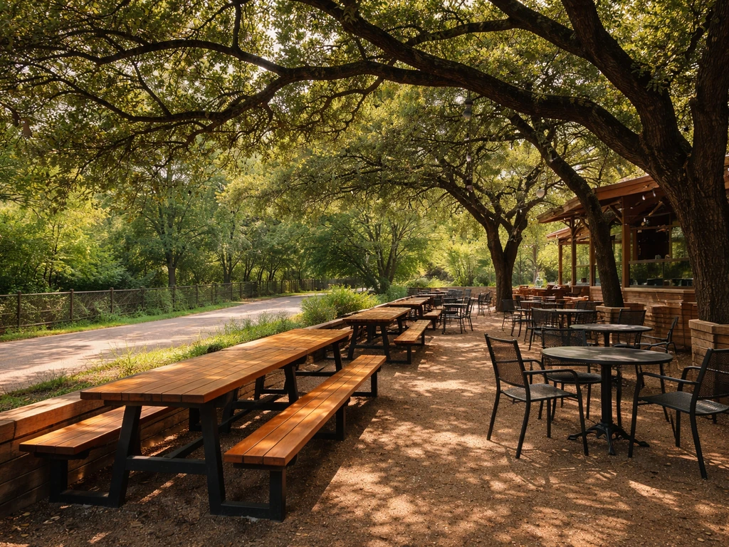 Katy Trail Ice House patio along Dallas’ Katy Trail under live oak canopy shade