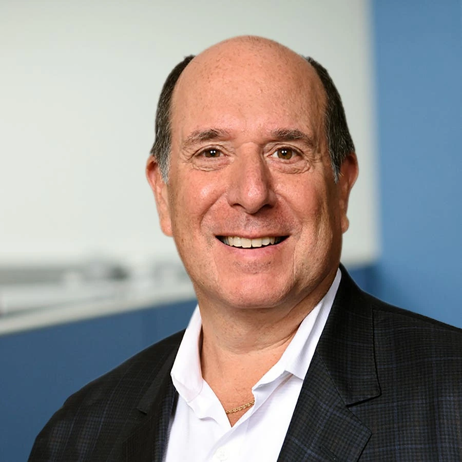 Portrait of Mark S. Ain, founder of Kronos