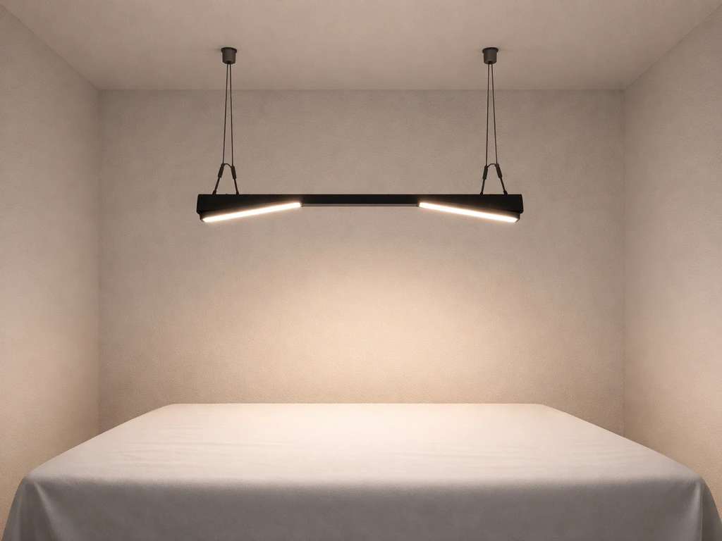 Bar-style LED panels slightly tilted inward on adjustable hangers, concentrating light onto canopy center.
