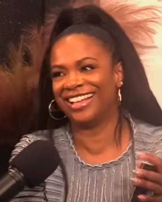 Kandi Burruss smiling during an interview
