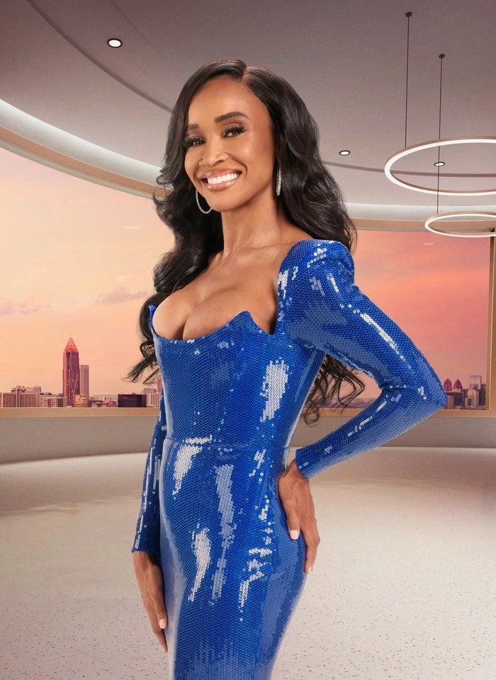 Dr. Contessa Metcalfe smiling in a blue sequined dress