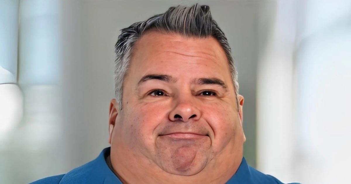 Big Ed (Edward Allen Brown) smiling in a close-up portrait