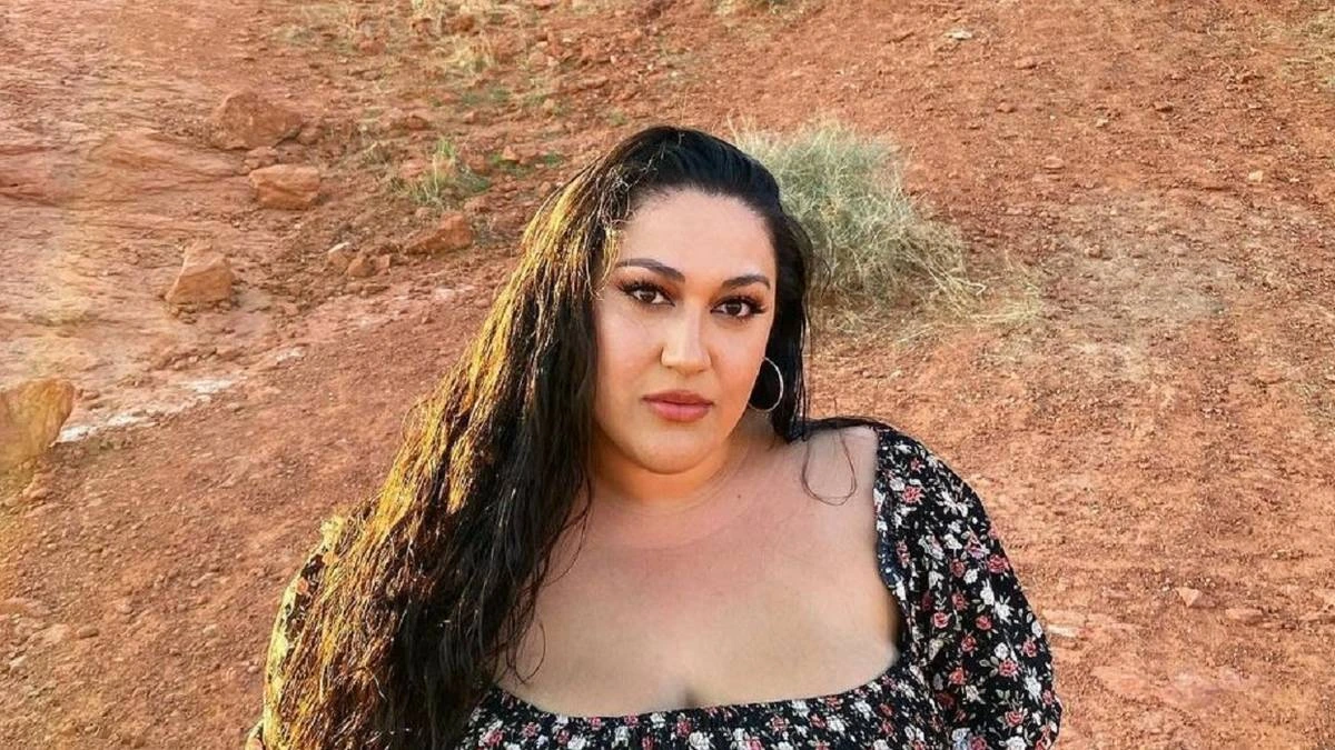 Kalani Faagata portrait outdoors against a rocky background