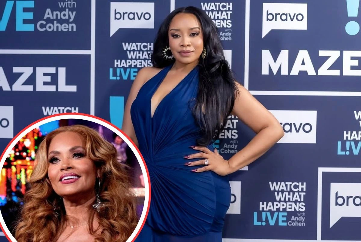 Angel Massie posing on a Bravo event backdrop in a blue dress