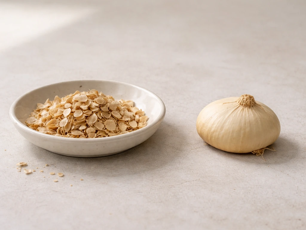 A close-up of dried plant seeds next to a firm corm on a clean kitchen surface