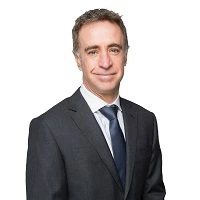 Portrait photo of Ricus Grimbeek in a suit