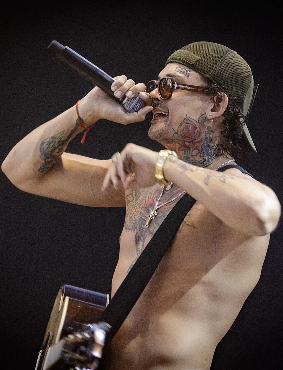 Morgenshtern performing on stage with a microphone