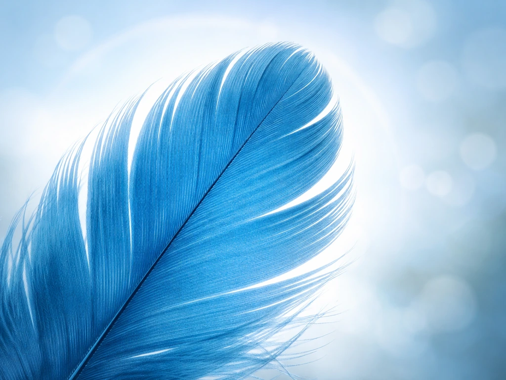 Vivid blue feather close-up with a soft, subtle throat-chakra-like light glow behind it.