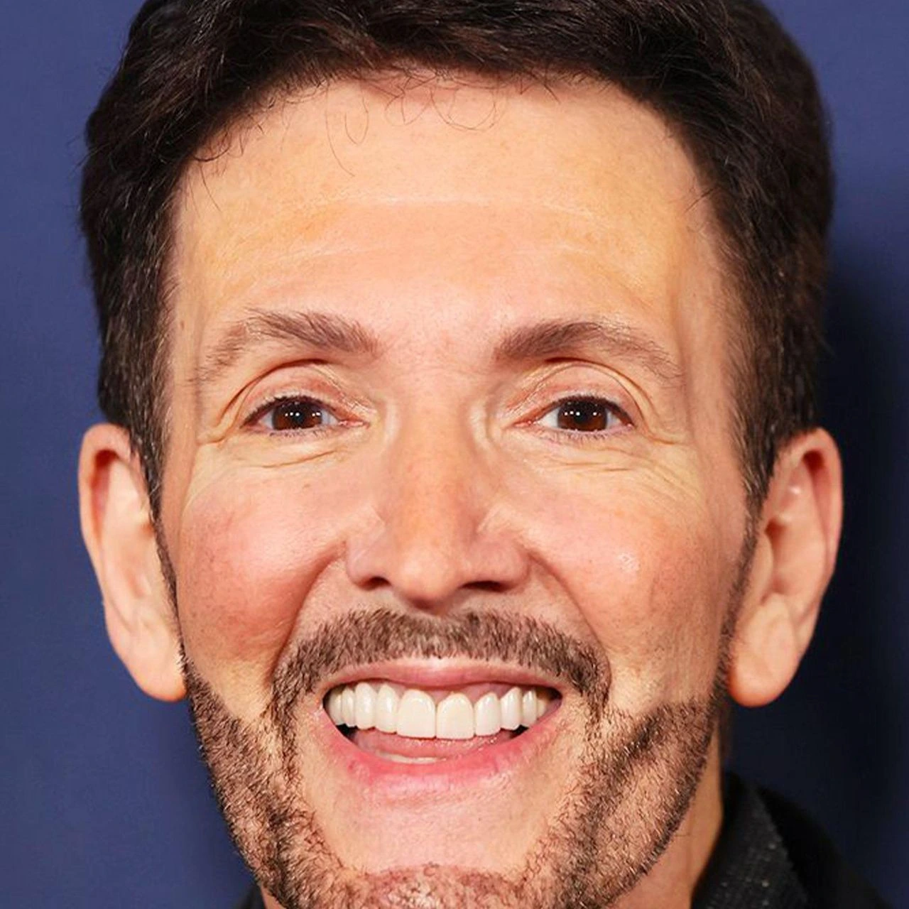 Eric Vetro smiling in a close-up portrait.