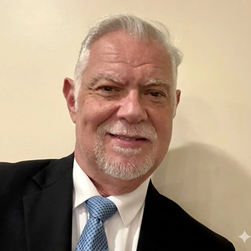 Portrait of Otto M. Vega, MD in a suit and tie