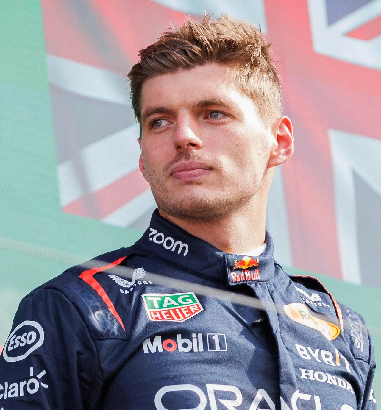 Max Verstappen in Red Bull racing suit at a Formula 1 event