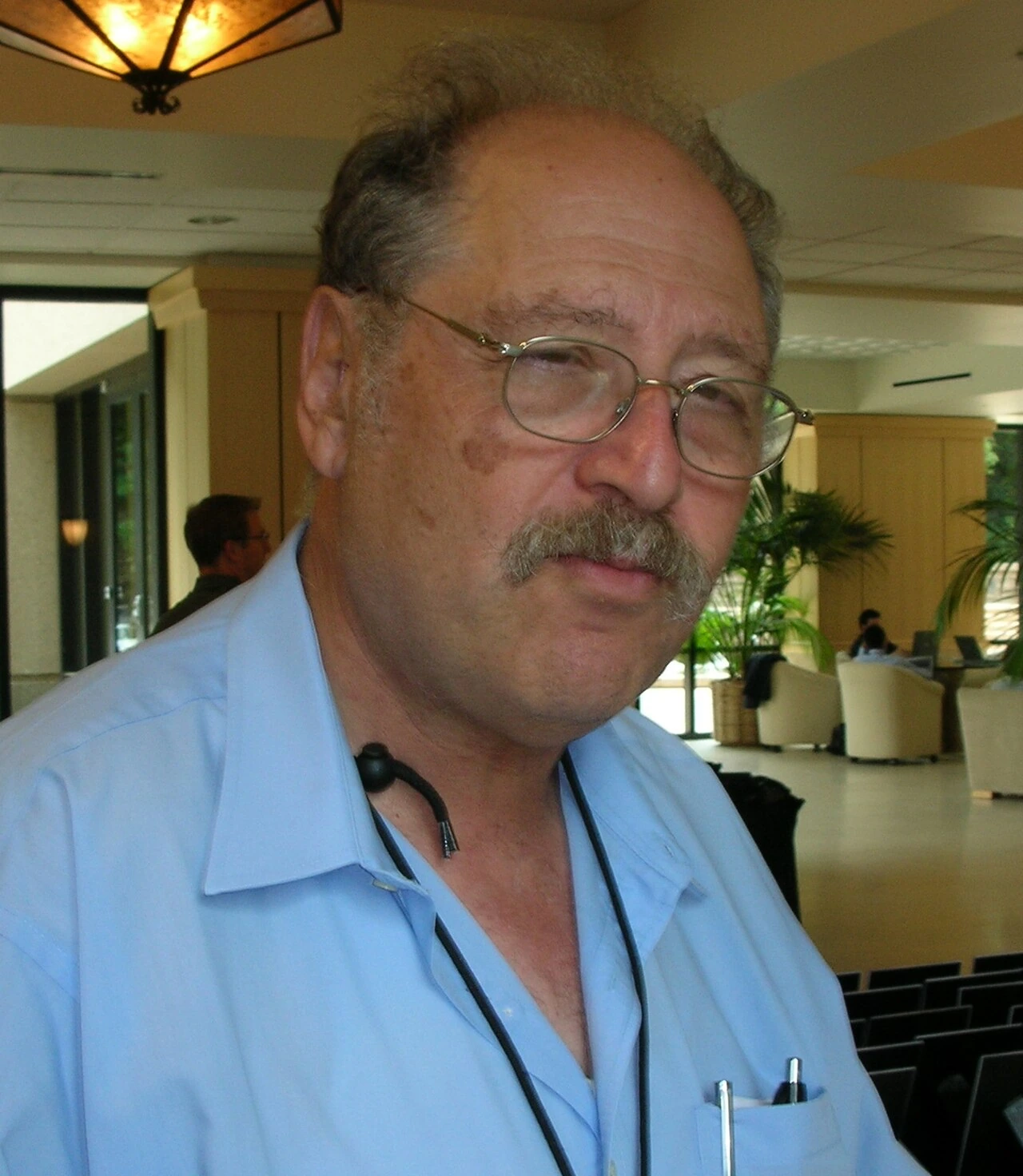 Yossi Vardi, Israeli entrepreneur and investor, in a candid indoor photo