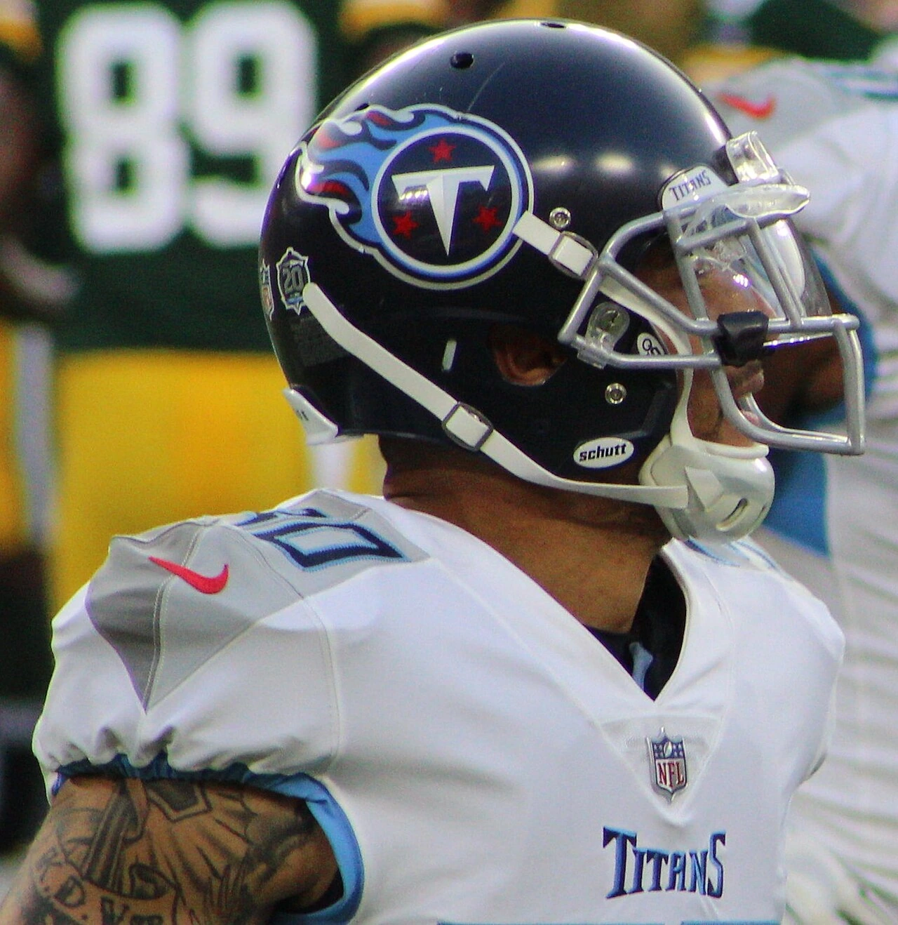 Kenny Vaccaro in a Tennessee Titans uniform and helmet on the sideline during an NFL game.