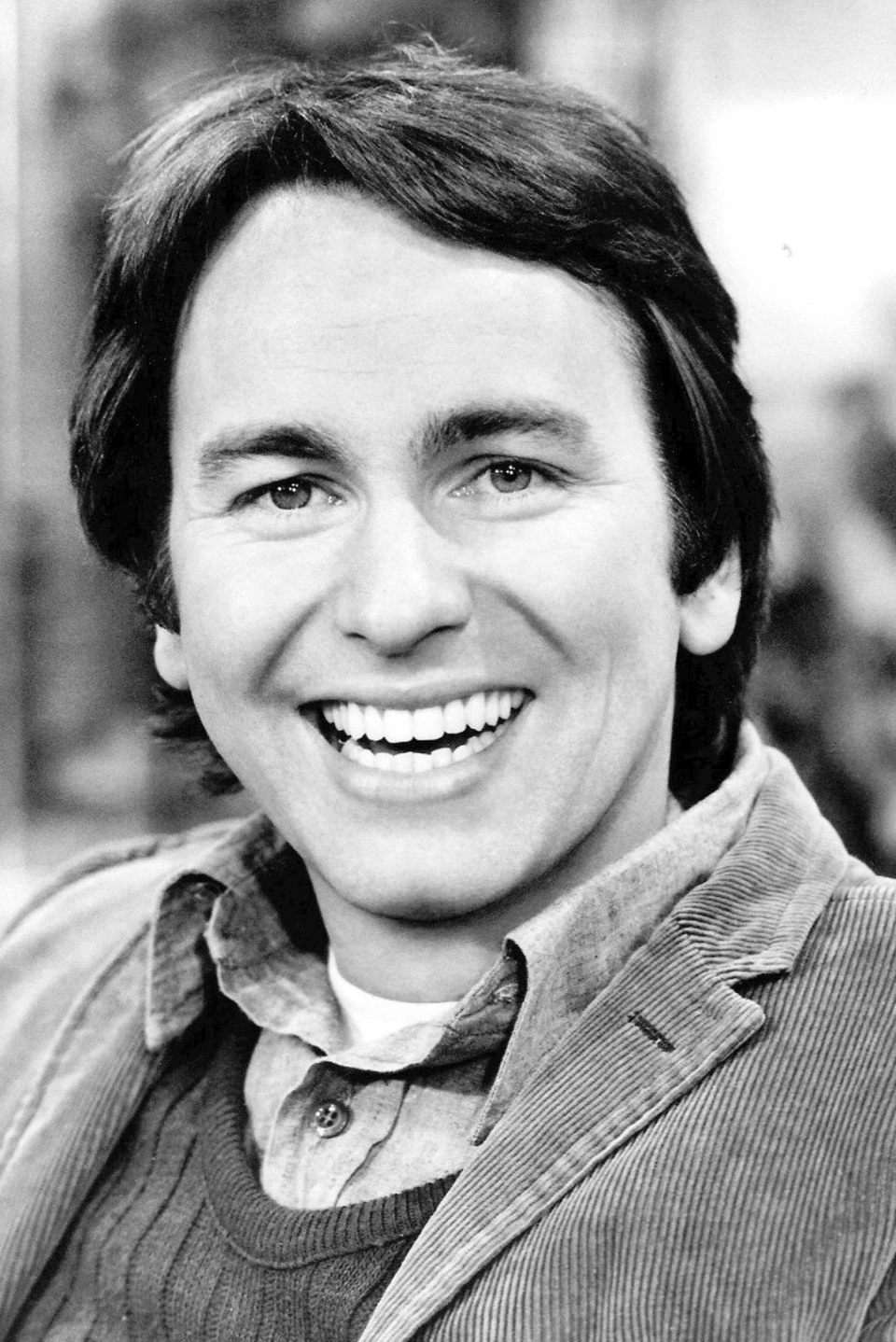 Black-and-white portrait of John Ritter smiling