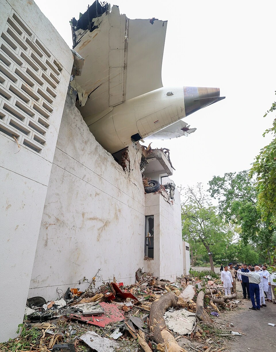Wreckage of Air India Flight 171 after the crash, with the aircraft embedded in a building