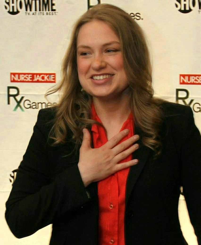 Merritt Wever smiling at a red carpet event