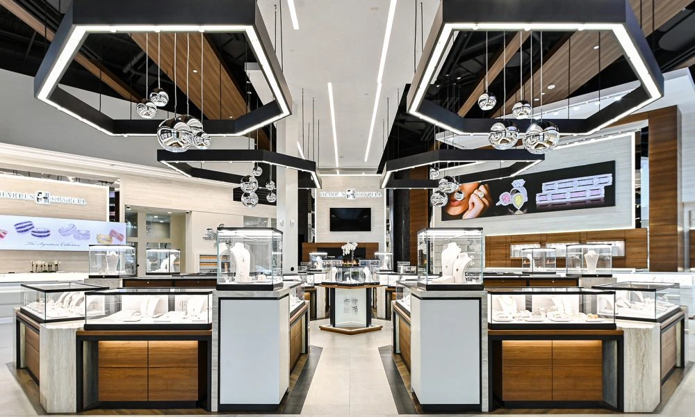 Interior of a Charles Krypell jewelry store with glass display cases and modern lighting.
