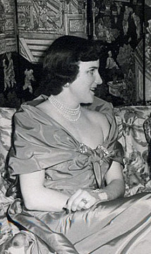 Black-and-white portrait of Marion Saffold Oates Charles seated in profile, wearing an evening dress and pearls.