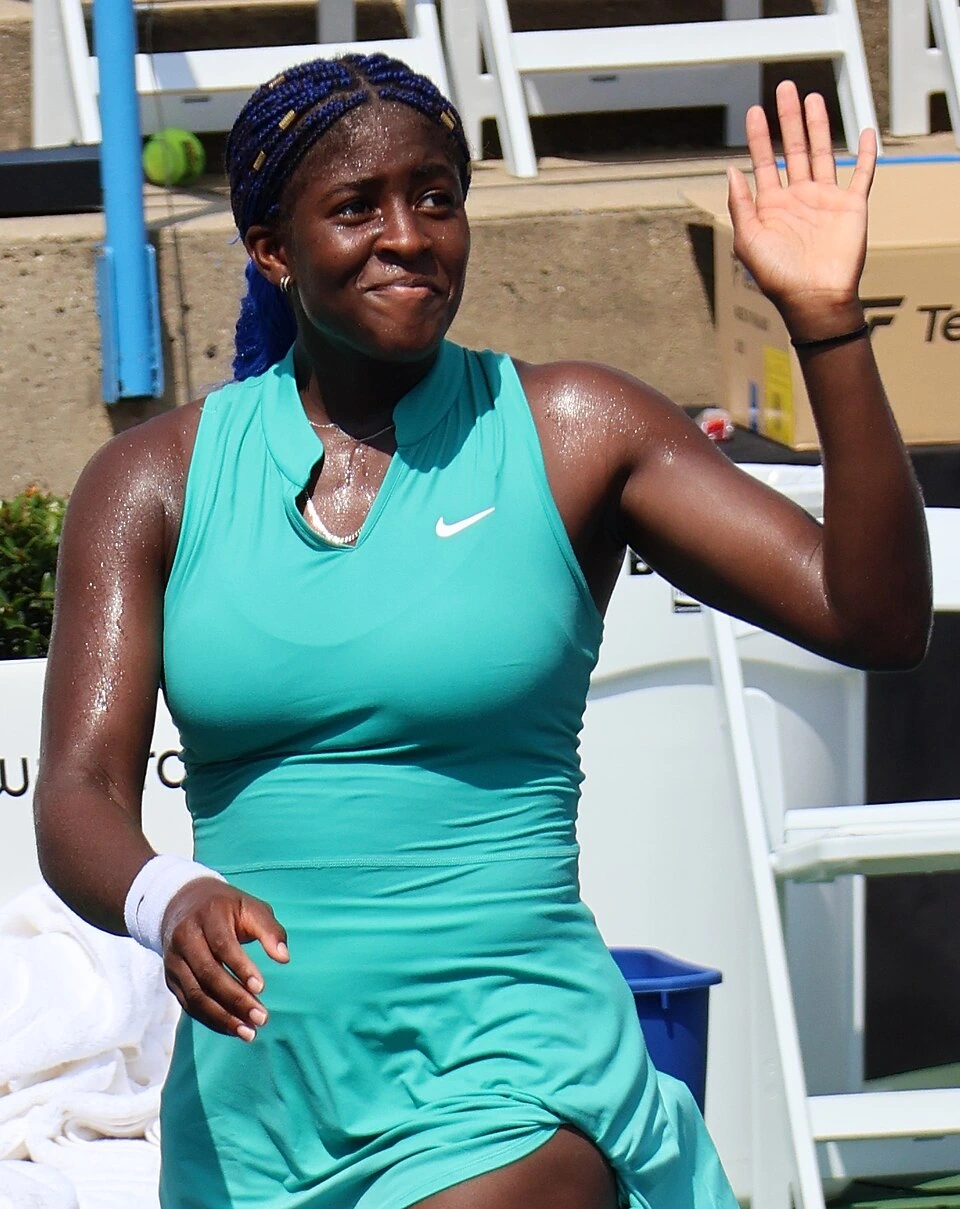 Clervie Ngounoue at the 2023 French Open, holding a tennis ball on court
