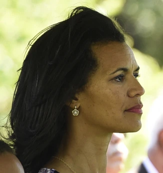 Fredricka Whitfield in profile at an outdoor ceremony