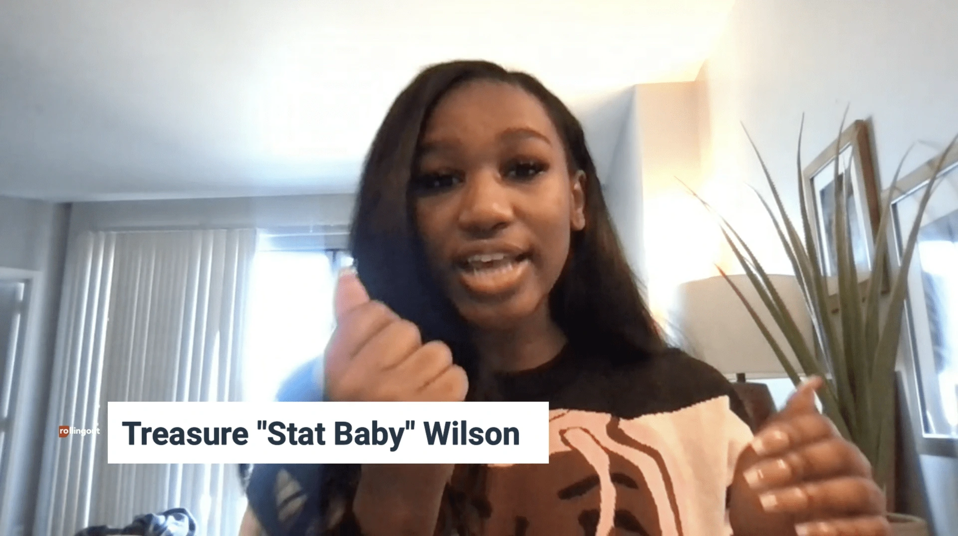 Treasure "Stat Baby" Wilson speaking on camera indoors